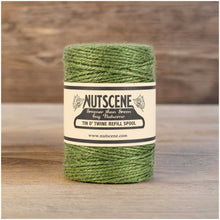 Green twine spool with Nutscene label on a white background